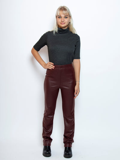 Women's faux leather slim leg pant in burgundy red
